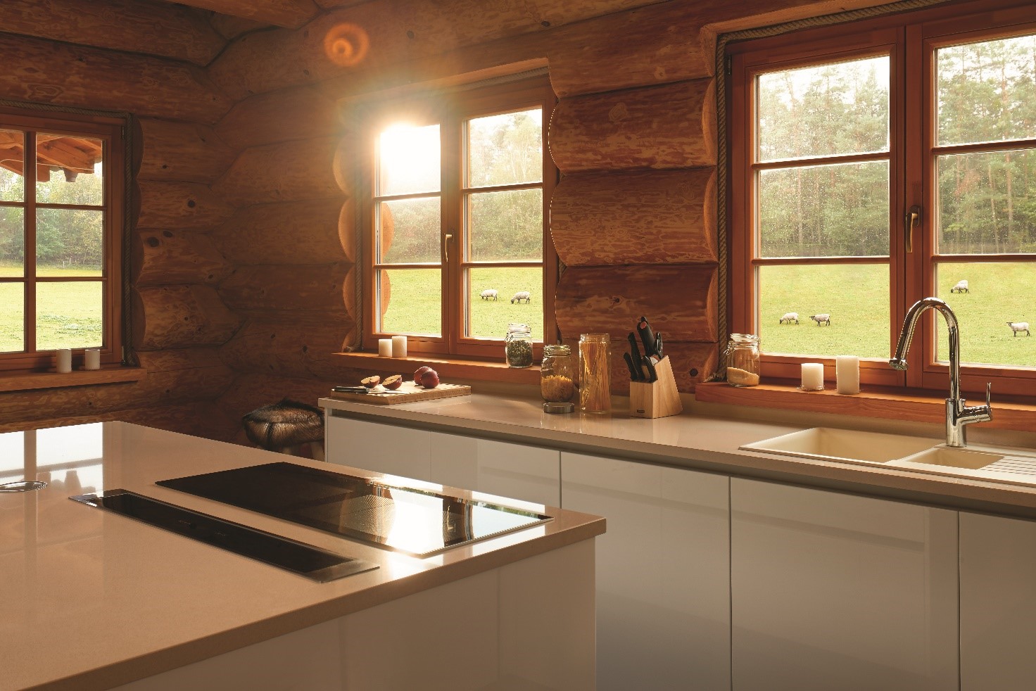 Bright creamy kitchen with TechniStone® kitchen countertop in a wooden log