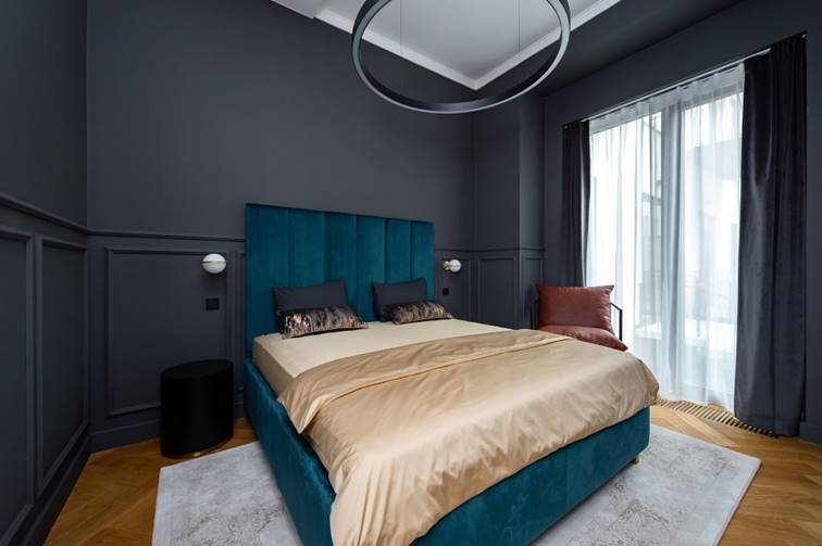 cyan bed in bedroom and gray interior